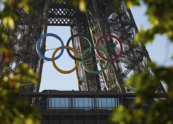 Olympic Rings Mounted on Eiffel Tower with 50 Days to Go Until Paris Games